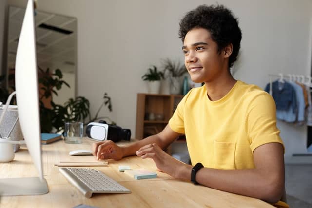 Boy using iMac